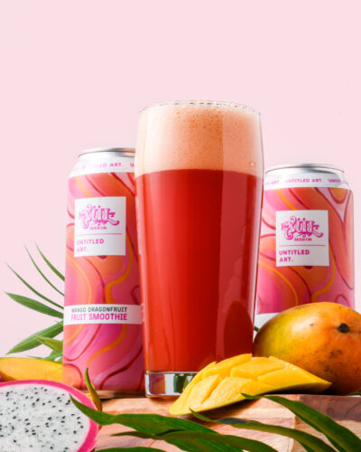 A can of dragon fruit beer next to some fruit.