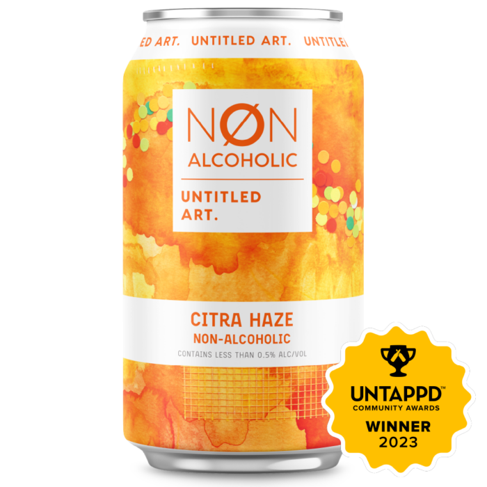 A 6pk of non-alcoholic citra haze beverage with a colorful abstract design on the label, and a badge indicating it won a 2023 untappd community award.