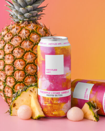 A can of beer with a pineapple on it.