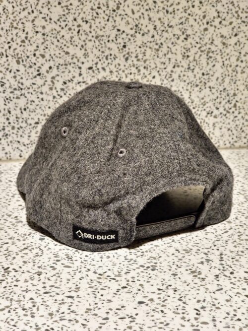 A Untitled Art Logo Patch Hat - Grey Wool Blend with a logo on it.