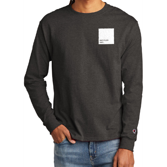 A man wearing a black Untitled Art Logo Long Sleeve Tee with a white square on it.